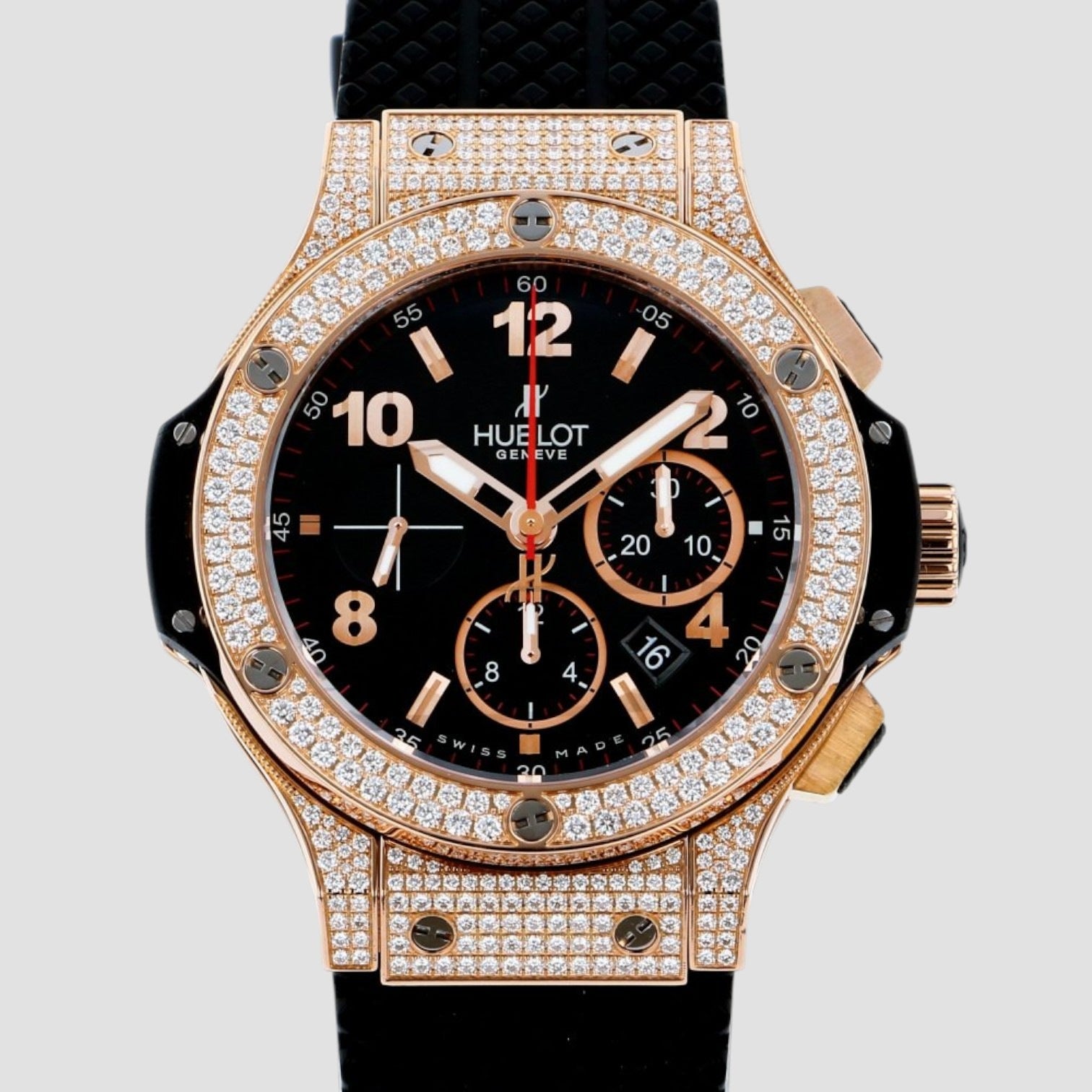 Luxury watch with rose gold case and black dial on a light gray background