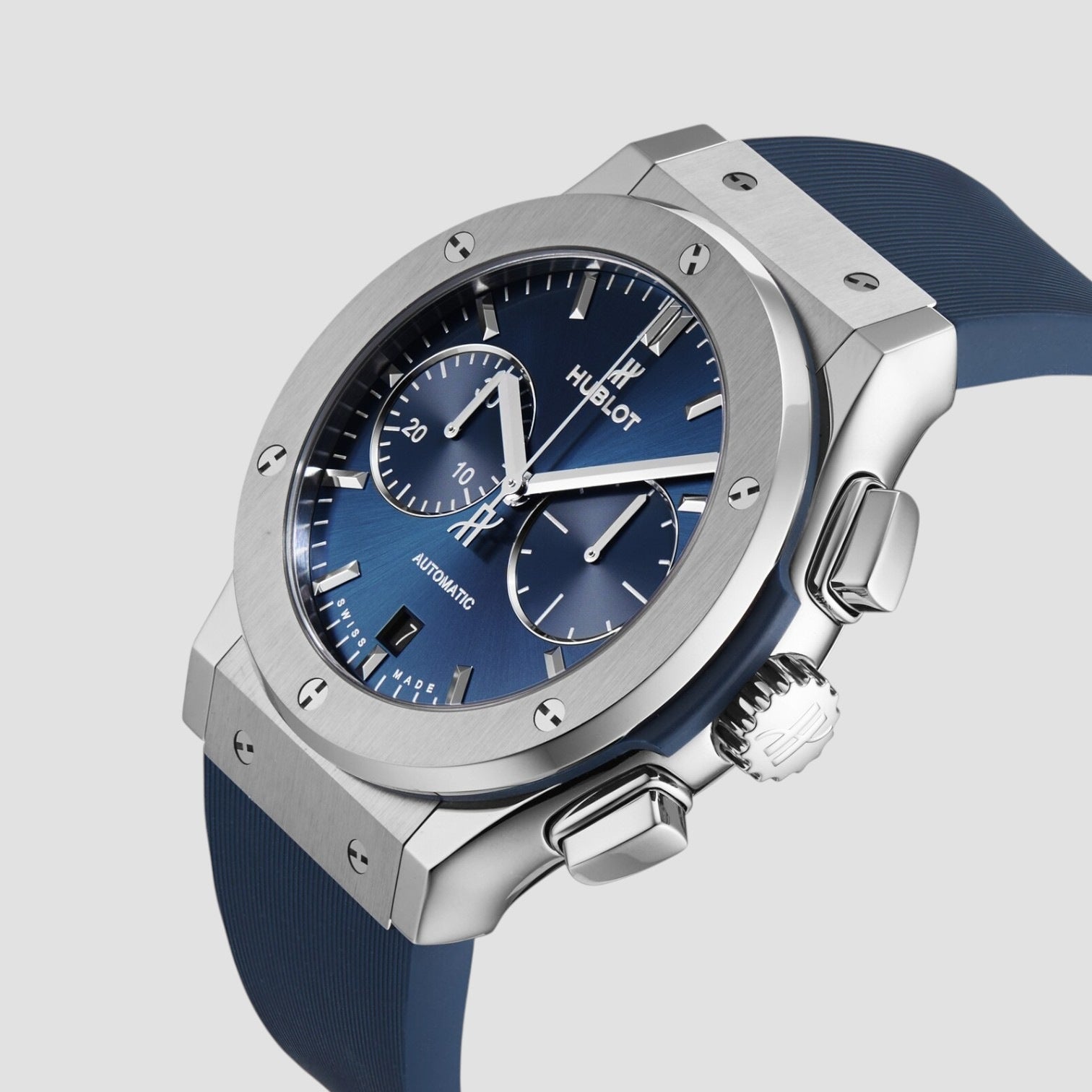 Hublot watch with blue face and strap on a light gray background
