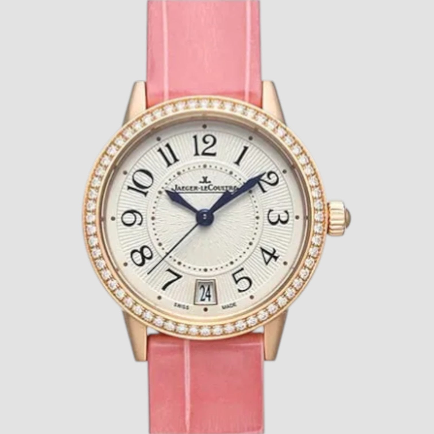 Watch with pink strap and gold casing on a light gray background