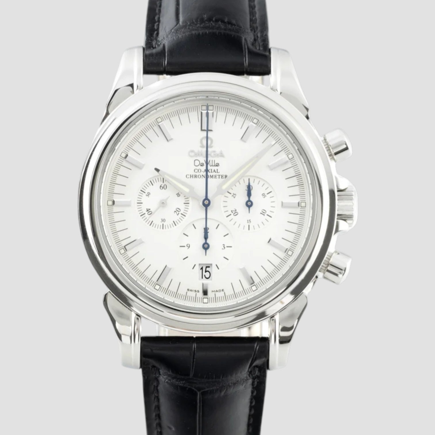 Luxury watch with black leather strap and silver case on a light gray background