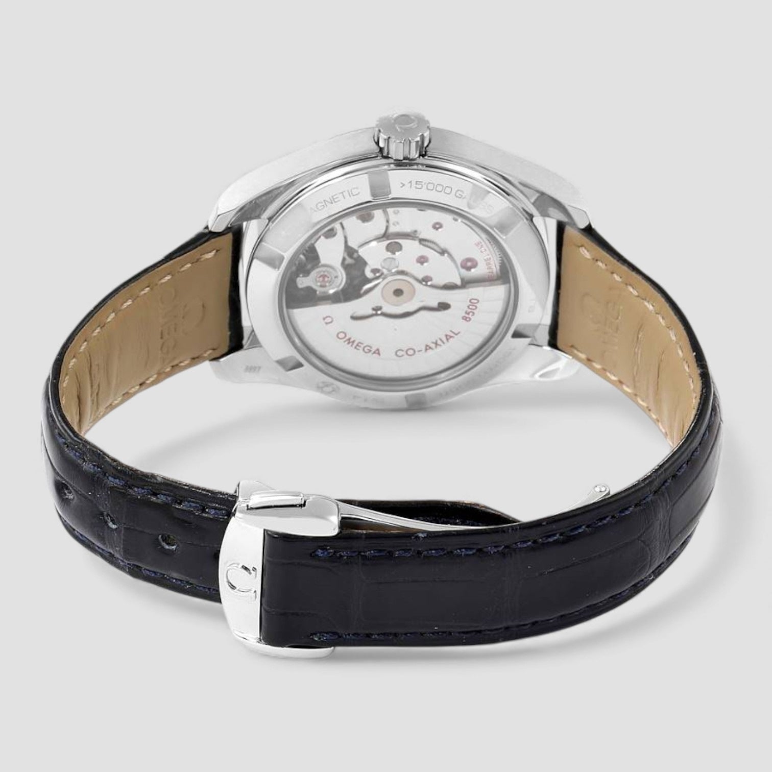 Omega watch with black leather strap on a light gray background