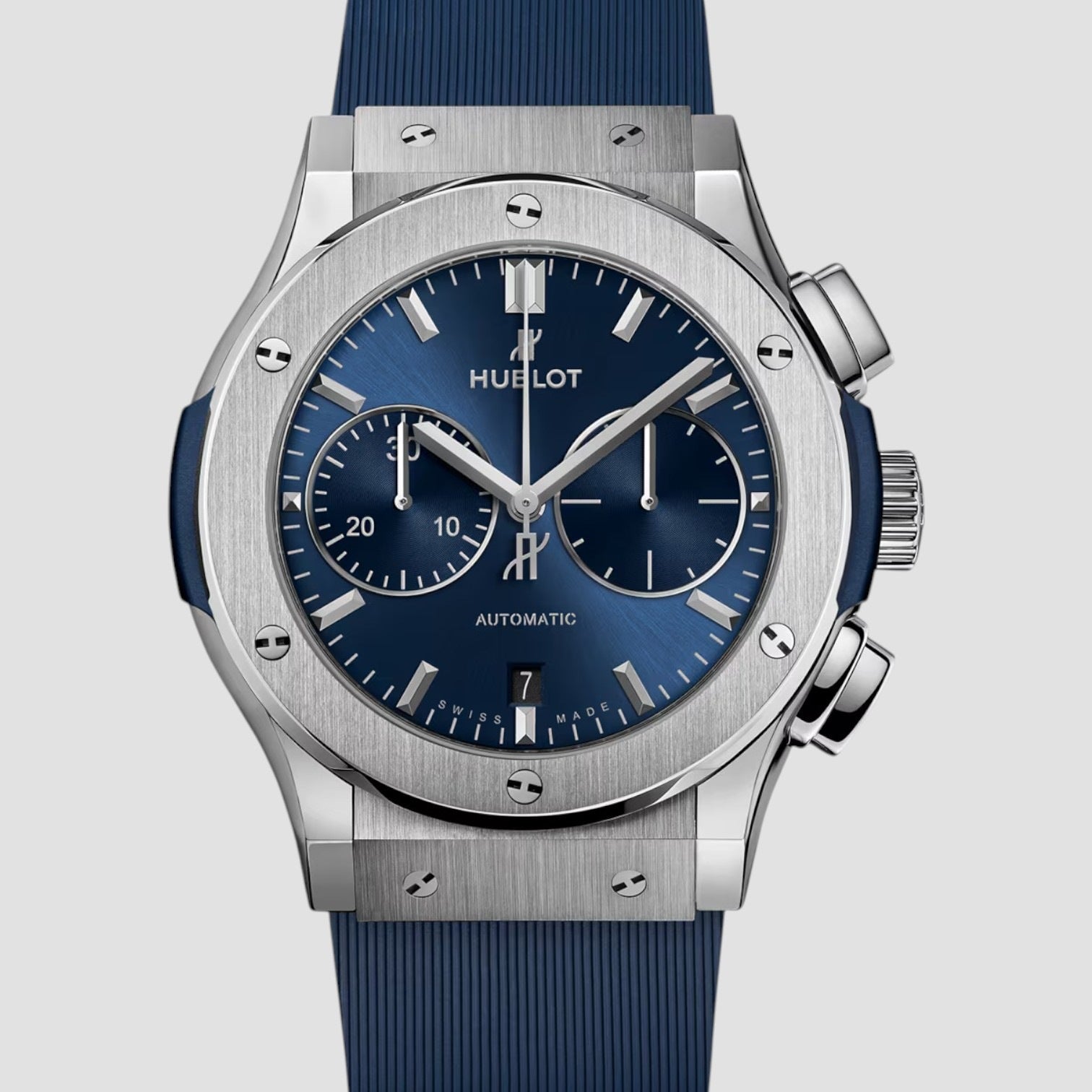 Hublot watch with blue strap and blue dial on a light gray background