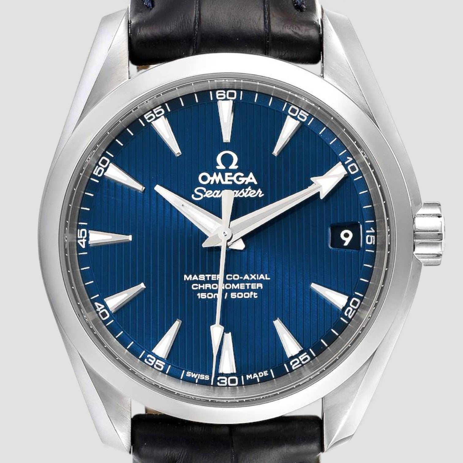 Omega Seamaster watch with blue dial and black leather strap on a light gray background
