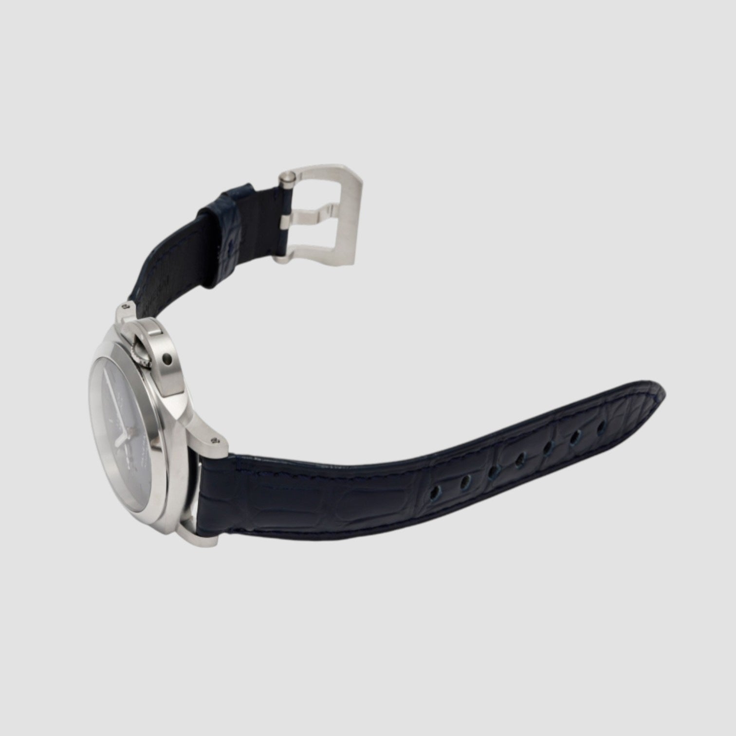 Watch with a black strap and silver case on a light gray background
